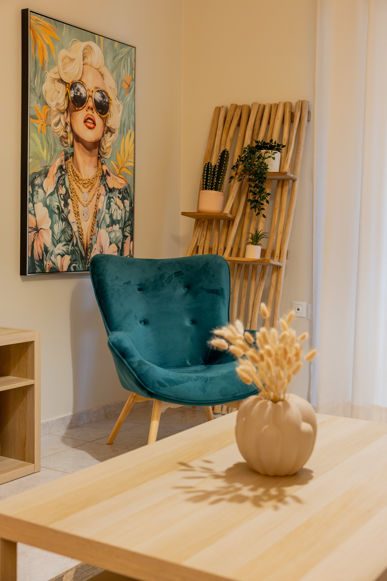 Reading corner with velvet armchair and artwork
