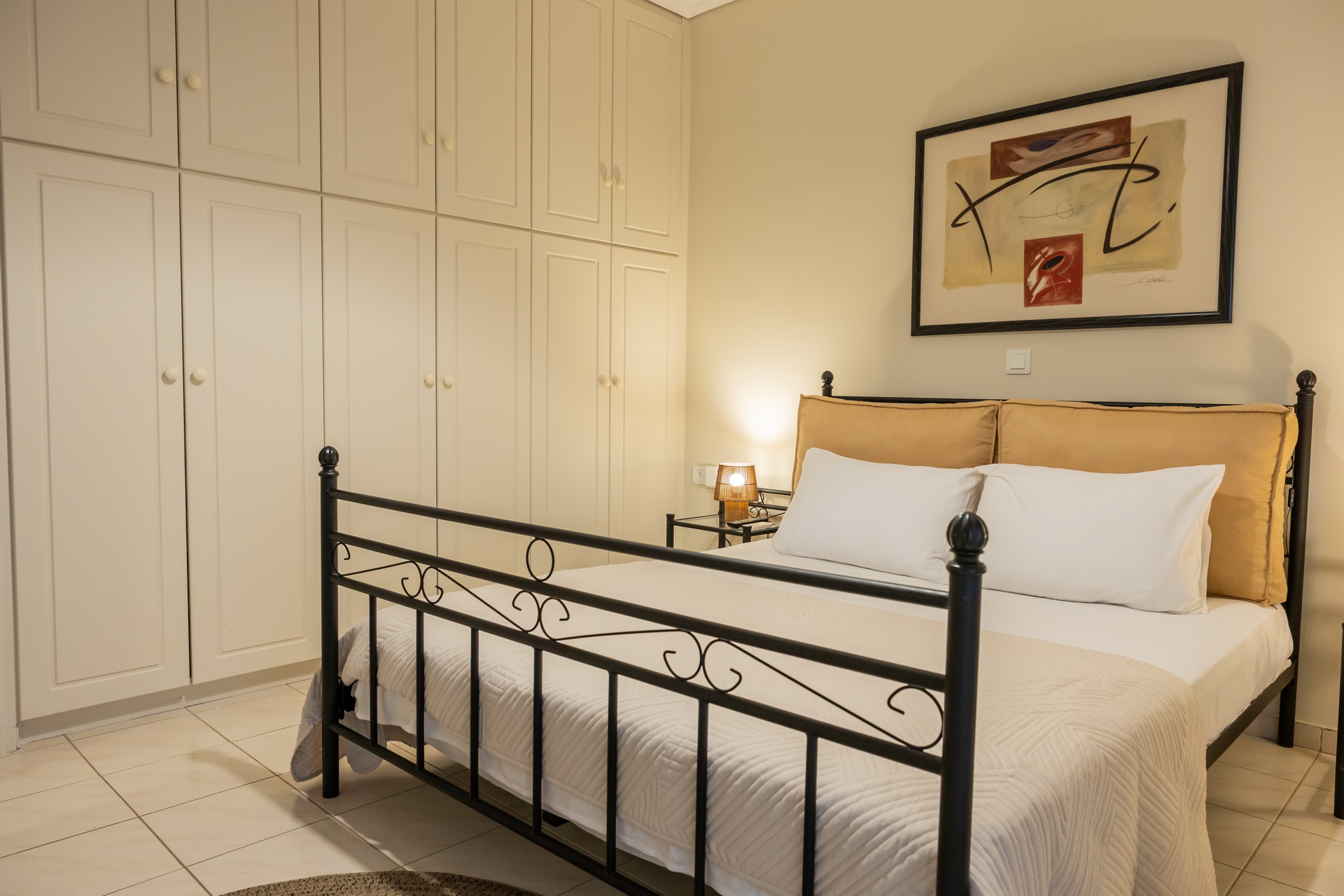 The bedroom with double bed and fitted wardrobes