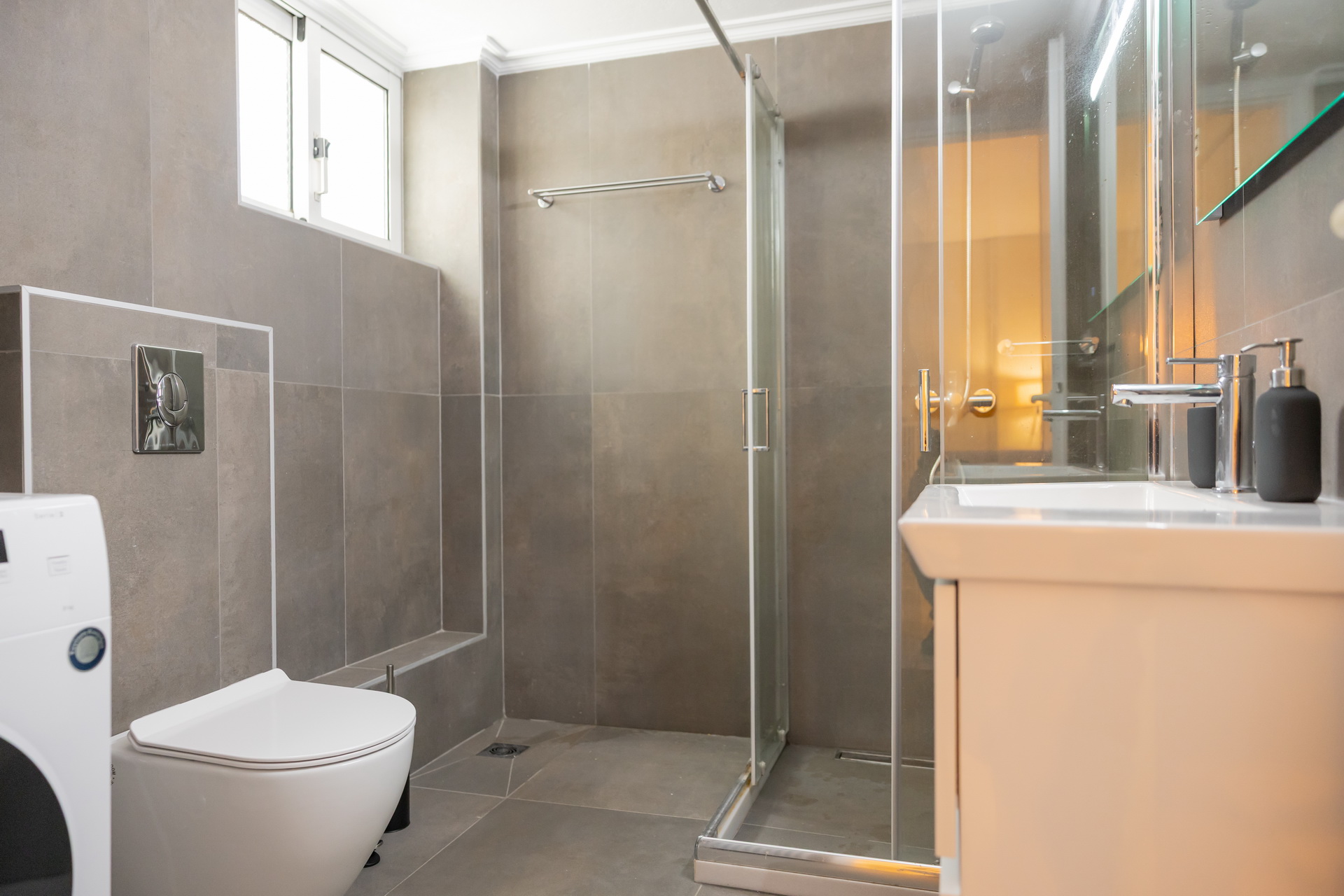 The bathroom with walk-in shower