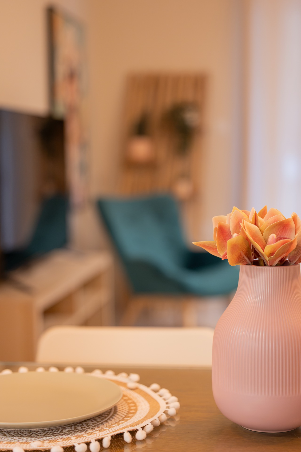 Flowers and a place setting on the dining table