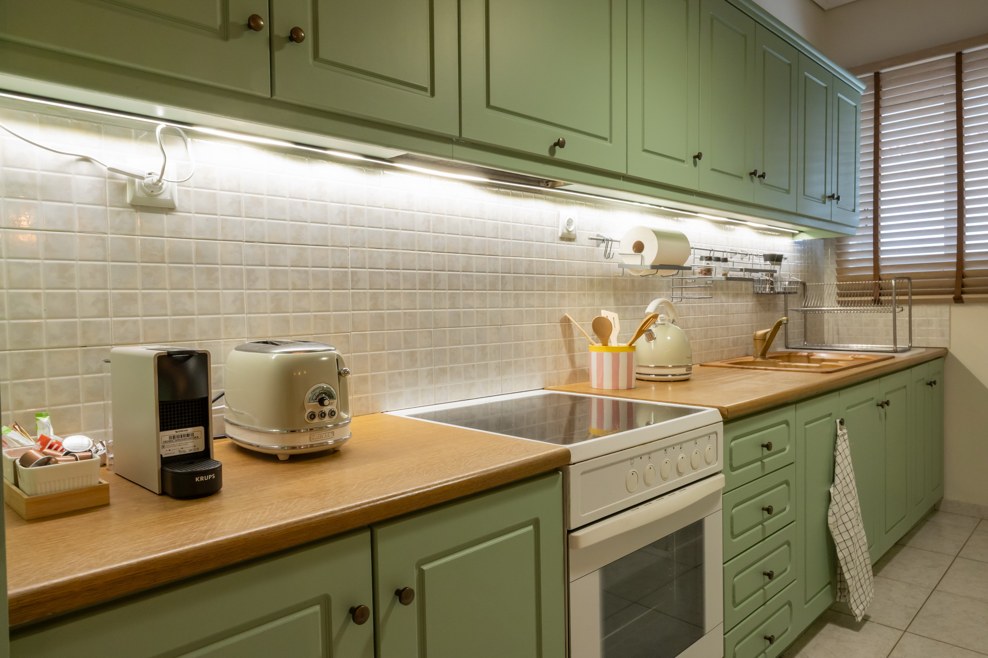 Kitchen counter with toaster, coffee machine and oven