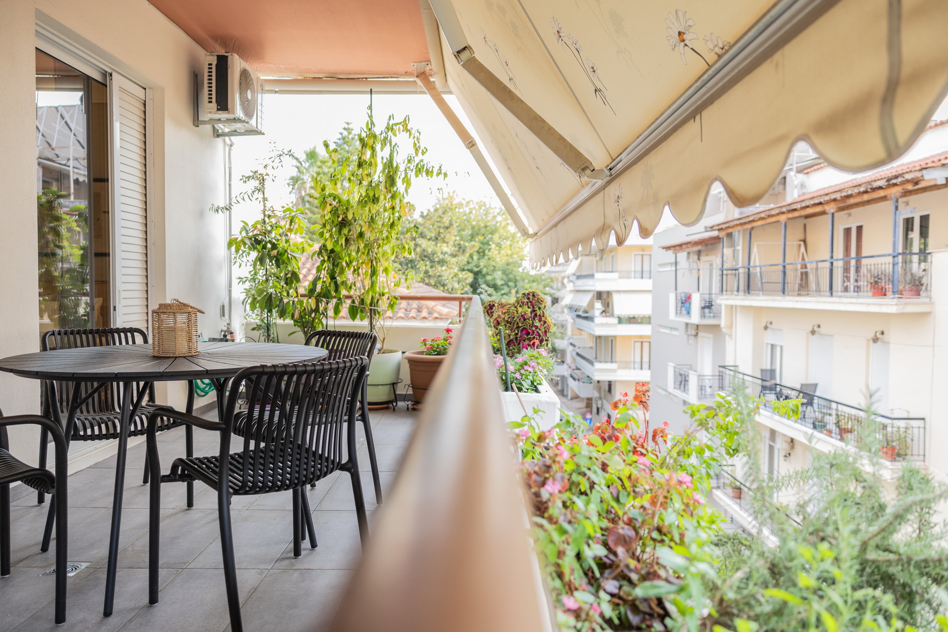 The private balcony with table, chairs and plants