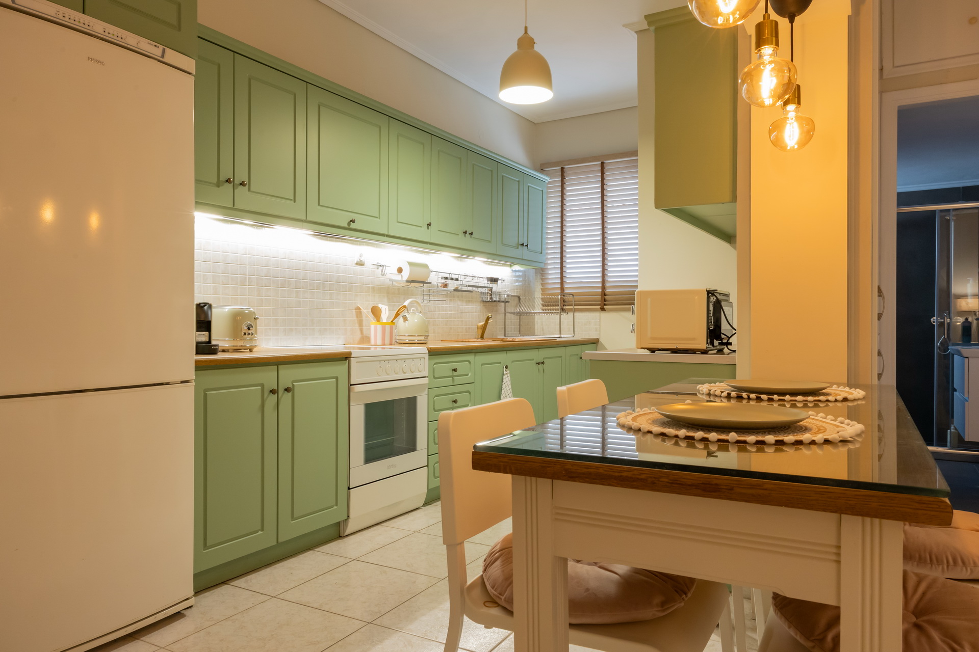 The kitchen and dining table under pendant lights